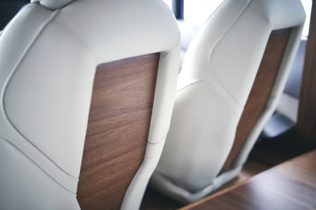 f55-interior-helm-seating-detail-walnut-satin-2022