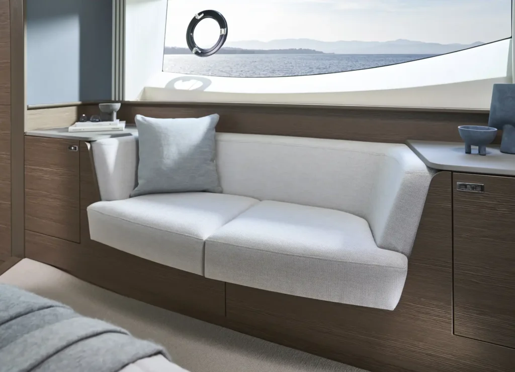 s65-interior-owners-stateroom-sofa-silver-oak-satin