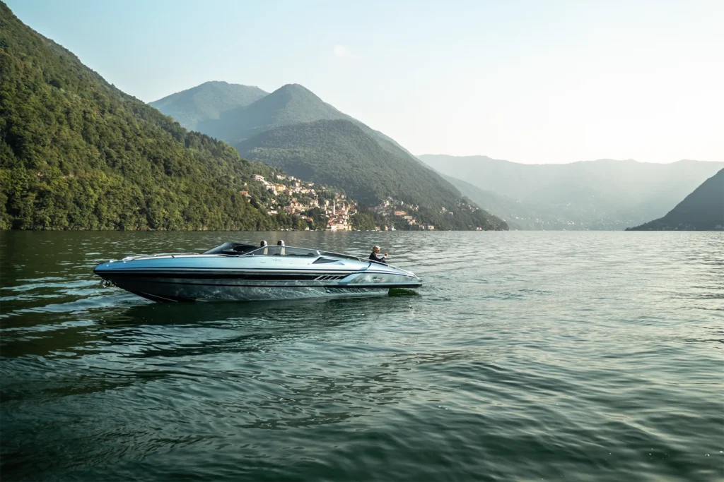 Sleek exterior view of the A. Mostes Cantieri M34 Sport yacht docked near the water, showcasing its streamlined hull, open deck layout, and modern marine design.