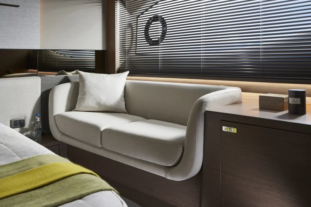 v55-interior-owners-stateroom-sofa-silver-oak-satin