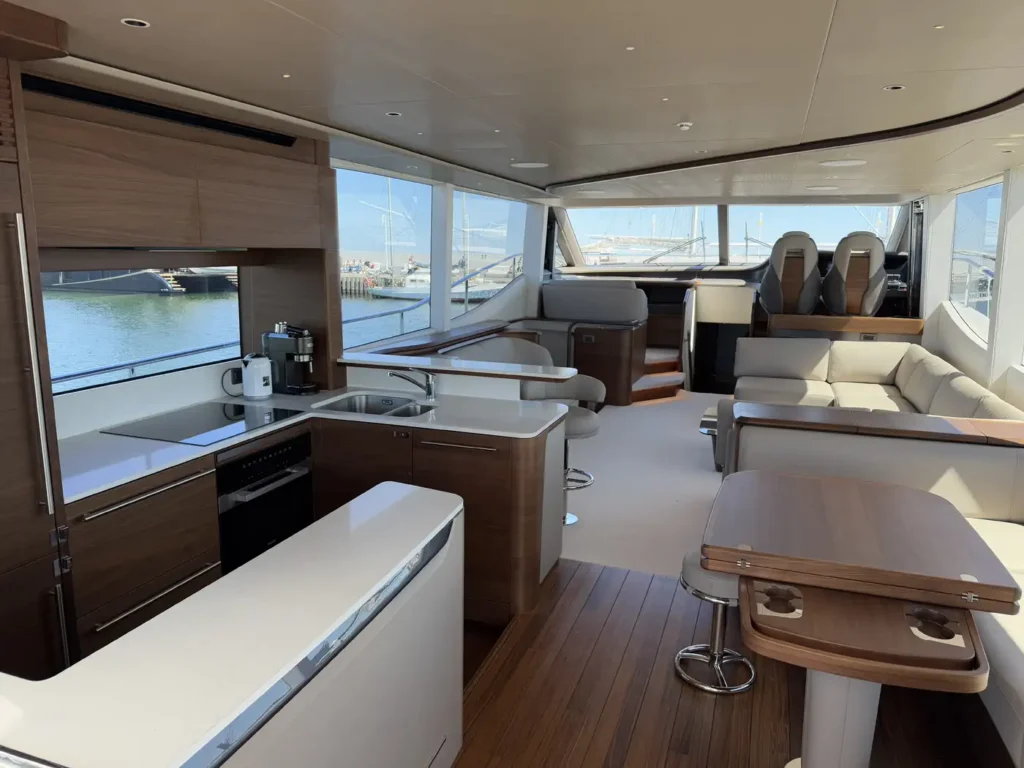Avcon-Yacht_Princess_Y72_aft-cockpit-seating-and-table-under-cover